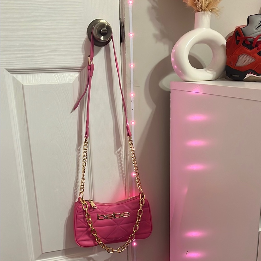 Bebe Pink and Gold Crossbody Bag with Chain Detailing
